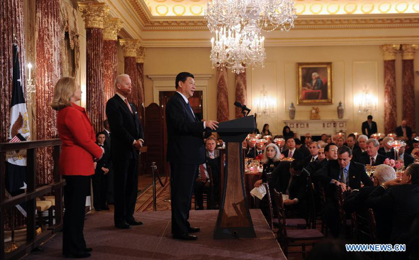Chinese Vice President Xi Jinping addresses a luncheon jointly hosted by his U.S. counterpart Joe Biden and U.S. Secretary of State Hillary Clinton in Washington, the United States, Feb. 14, 2012.