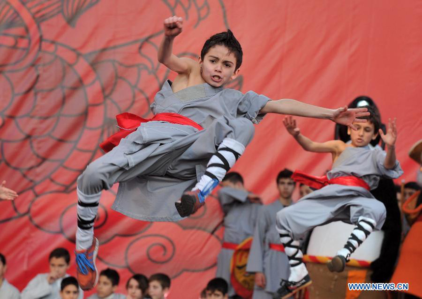 Children of local martial arts association perform Chinese Kungfu at Piazza del Popolo during the closing celebration of the Chinese Culture Year in Italy in downtown Rome, Italy, Jan. 14, 2012. Inaugurated in October 2010, the Chinese Culture Year in Italy has brought nearly 200 events to 12 regions across Italy, boosting cultural exchanges among the two peoples. 