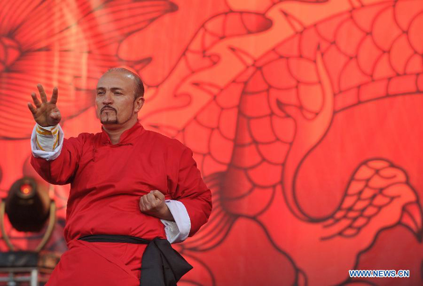 A coach of local martial arts association performs Chinese Kungfu at Piazza del Popolo during the closing celebration of the Chinese Culture Year in Italy in downtown Rome, Italy, Jan. 14, 2012. Inaugurated in October 2010, the Chinese Culture Year in Italy has brought nearly 200 events to 12 regions across Italy, boosting cultural exchanges among the two peoples.