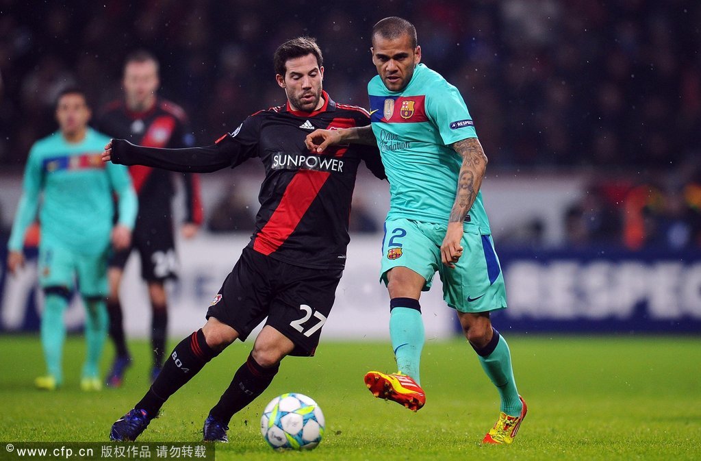 Gonzalo Castro of Leverkusen challenges Daniel Alves of Barcelona during the UEFA Champions League round of 16 first leg match between Bayer 04 Leverkusen and FC Barcelona at BayArena on February 14, 2012 in Leverkusen, Germany. 