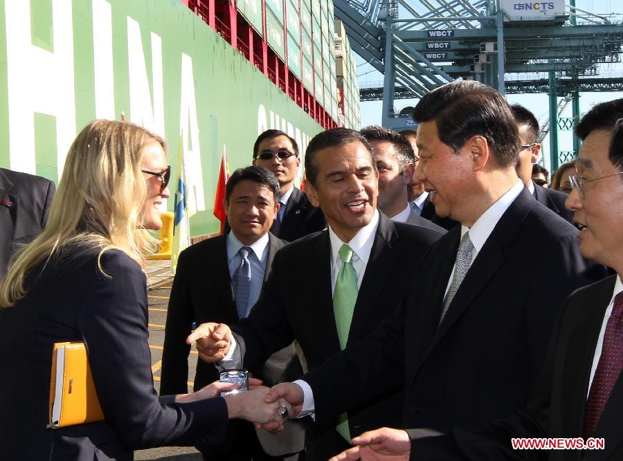 Chinese Vice President Xi Jinping (2nd, R) shakes hands with an employee as he tours China Shipping at the Port of Los Angeles in Los Angeles, California, the United States, on Feb. 16, 2012. [Lan Hongguang/Xinhua]