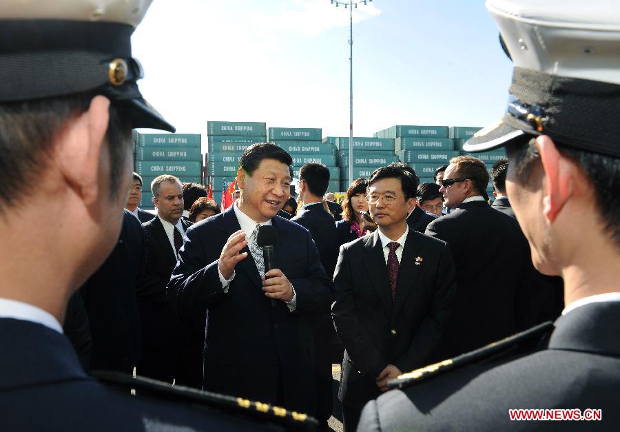 Chinese Vice President Xi Jinping (L, central) talks to crew as he tours China Shipping at the Port of Los Angeles in Los Angeles, California, the United States, on Feb. 16, 2012. [Liu Jiansheng/Xinhua] 