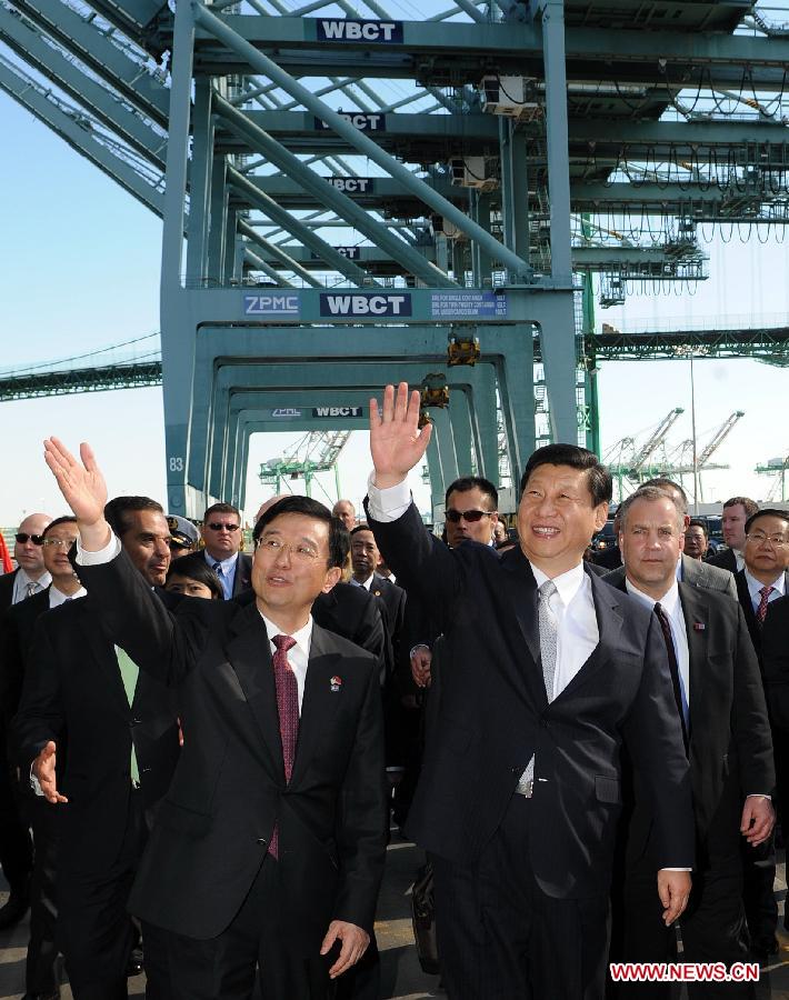 Chinese Vice President Xi Jinping (R, front) waves to crew as he tours China Shipping at the Port of Los Angeles in Los Angeles, California, the United States, on Feb. 16, 2012. [Liu Jiansheng/Xinhua]