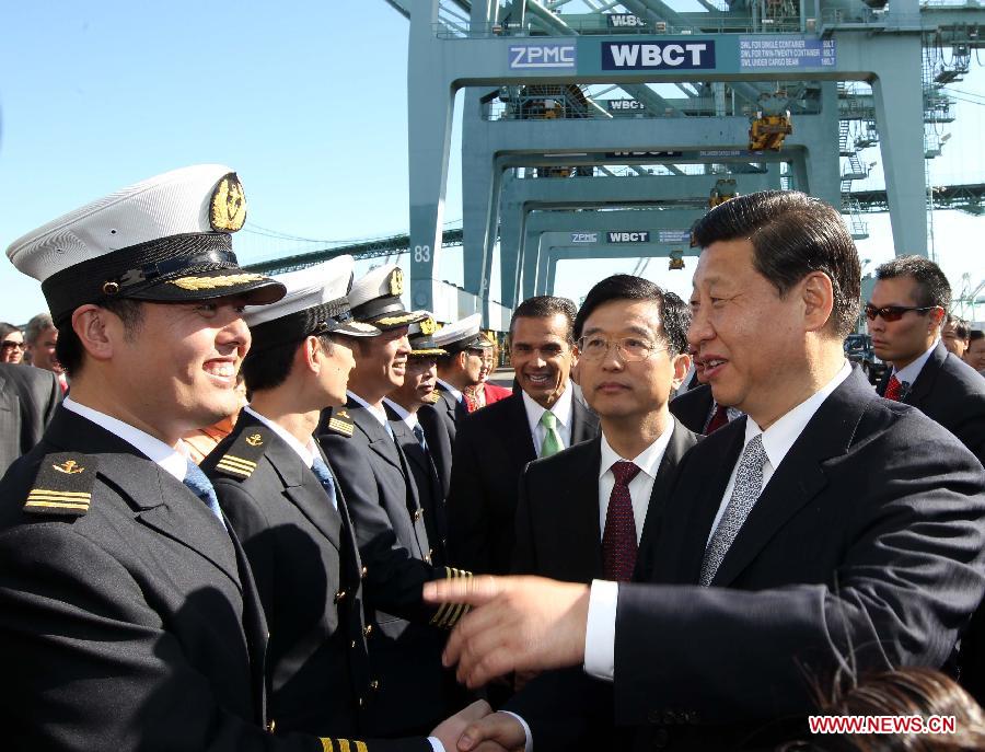 Chinese Vice President Xi Jinping (R, front) shakes hands with crew as he tours China Shipping at the Port of Los Angeles in Los Angeles, California, the United States, on Feb. 16, 2012. [Lan Hongguang/Xinhua] 