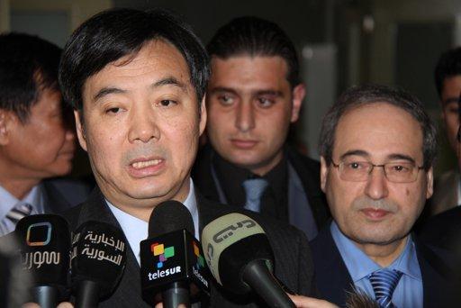 Chinese Deputy Foreign Minister Zhai Jun, left, speaks to reporters following a meeting with Syrian Deputy Foreign Minister Faisal Mekdad, right, in Damascus, Syria, on Friday Feb. 17, 2012.