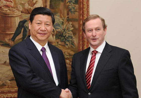 Chinews Vice President Xi Jinping (L) shakes hands with Irish Prime Minister Enda Kenny on Sunday. Xi arrived Saturday in Shannon, a scenic city in Ireland, kicking off his official visit to the country known as 'Emerale Isle.' 