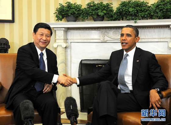 China's Vice-President Xi Jinping(L) meets with US President Barack Obama at the White House in Washington, February 14, 2012. 