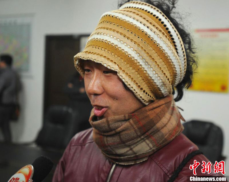 Japanese cycling enthusiast Keiichiro Kawahara, who is engaged on a global cycling tour, speaks to the media after his stolen bike is recovered by police in Wuhan City, capital of central China's Hubei Province, Feb. 20, 2012.