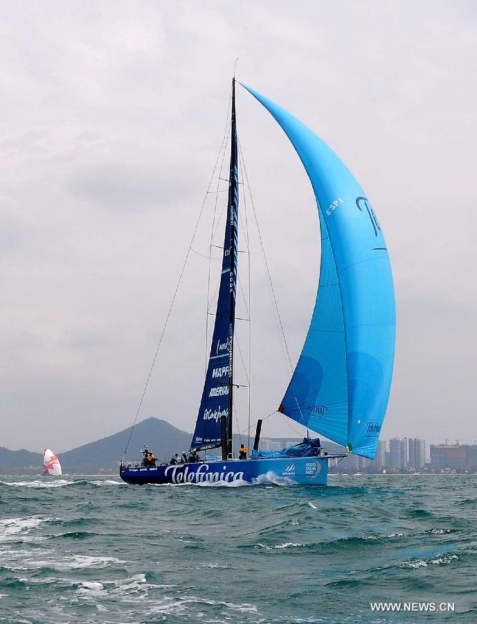  Spain's Team Telefonica competes in the In-Port-Race, which is a part of the Volvo Ocean Race, in Sanya, south China's Hainan Province, Feb. 18, 2012. Spain's Team Telefonica won the race Saturday. (Xinhua/Hou Jiansen) 