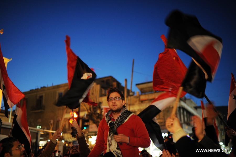 Syrians participate in a rally to protest against the article No.3 of the new draft constitution stating that the president of the country should be Muslim, in Damascus, Syria, Feb. 21, 2012. [Qin Haishi/Xinhua] 