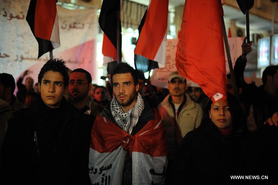 Syrians participate in a rally to protest against the article No.3 of the new draft constitution stating that the president of the country should be Muslim, in Damascus, Syria, Feb. 21, 2012. [Qin Haishi/Xinhua] 