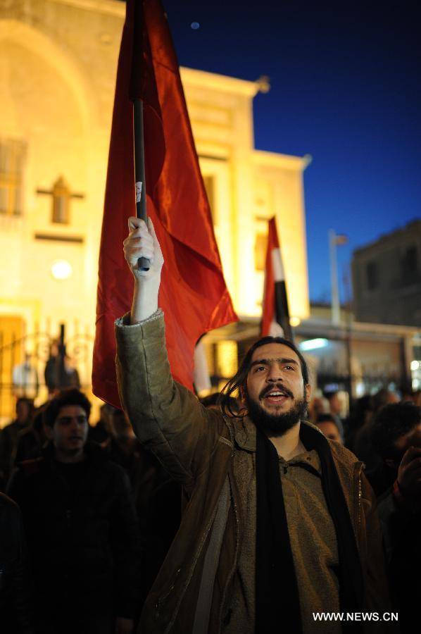 Syrians participate in a rally to protest against the article No.3 of the new draft constitution stating that the president of the country should be Muslim, in Damascus, Syria, Feb. 21, 2012. [Qin Haishi/Xinhua] 