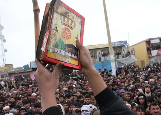 Thousands of Afghan people staged protest demonstration for the second day over a report that foreign soldiers improperly disposed and burned copies of the Muslim holy book Koran. 