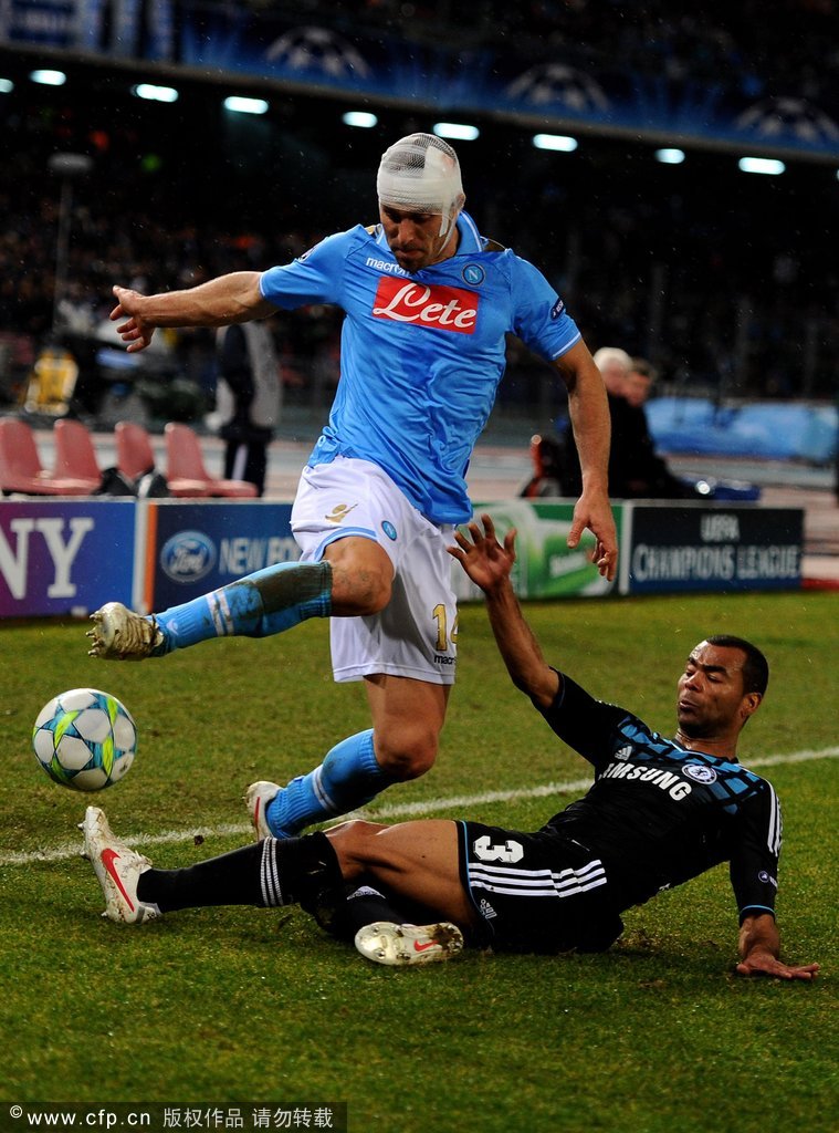 Hugo Campagnaro of Napoli is tackled by Ashley Cole of Chelsea during the UEFA Champions League round of 16 first leg match between SSC Napoli and Chelsea FC at Stadio San Paolo on February 21, 2012 in Naples, Italy. 
