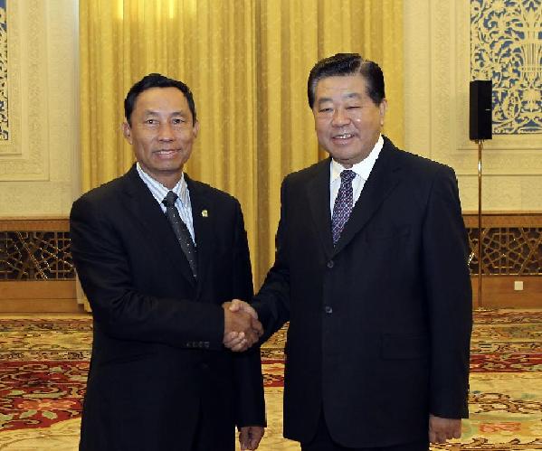 Jia Qinglin (R), chairman of the National Committee of the Chinese People's Political Consultative Conference (CPPCC), meets with Myanmar's Speaker of the House of Representatives Thura U Shwe Mann in Beijing, capital of China, Feb. 23, 2012. [Ding Lin/Xinhua]