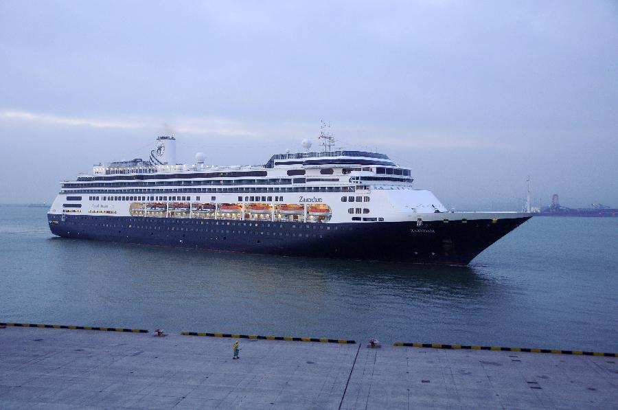 Zaandam, a luxury cruise ship owned by Holland America, arrives at the Tianjin International Cruise Home Port in Tianjin, north China, Feb. 25, 2012. A total of 1,100 passengers and 646 ship crew boarding Zaandam arrived in Tianjin from Hong Kong on Saturday morning. 