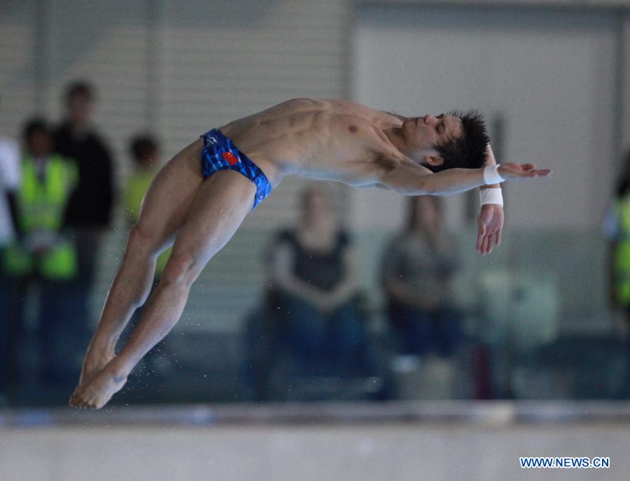 Qiu Bo of China competes during the Men's 10m Platform Final at the FINA Diving World Cup at the Olympic Aquatics Centre in London, Britain, Feb. 25, 2012. Qiu won the gold medal with 574.90 points. [Xinhua]