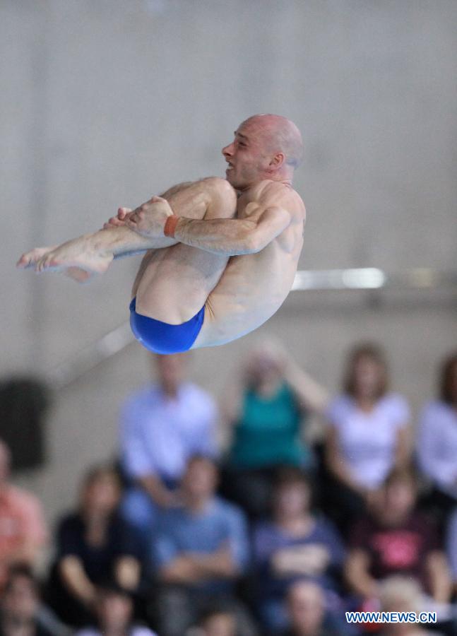 Peter Waterfield of Britain competes during the Men's 10m Platform Final at the FINA Diving World Cup at the Olympic Aquatics Centre in London, Britain, Feb. 25, 2012. Waterfield won the bronze medal with 510.35 points. [Xinhua]