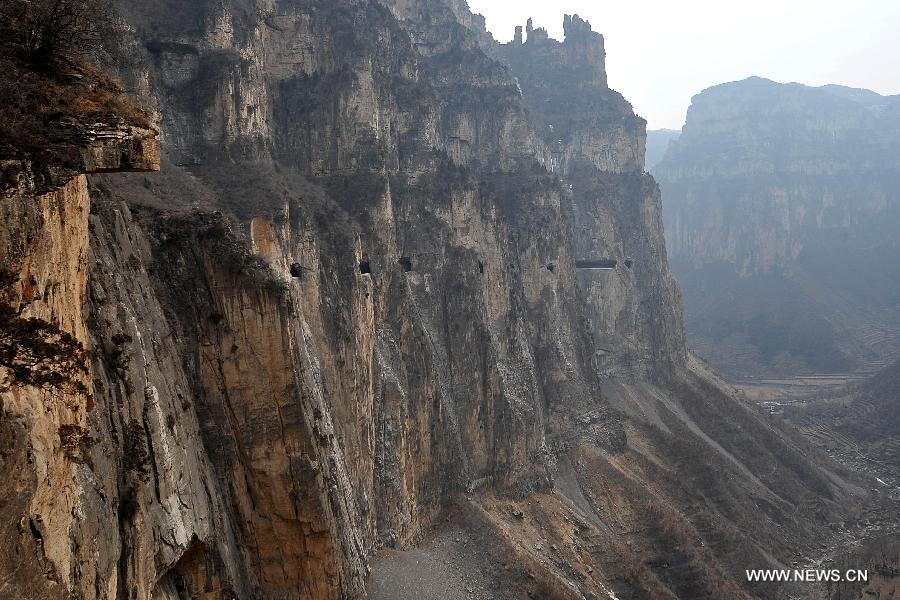 Photo taken on Feb. 24, 2012 shows the 'heavenly road' along the waist of the Taihang Mountains in Pingshun County, north China's Shanxi Province. The 1,526-meter-long road, which spirals up along the 1,100-meter-high Taihang Mountains is a shortcut to the Jingdi Village at the mountain foot. Local villagers spent 15 years to build the road and they call it 'heavenly road.'