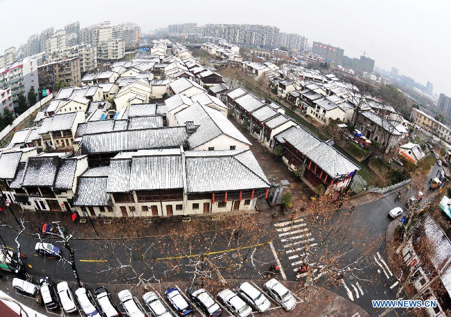 Picture taken with a fisheye lens shows the snow-covered rooves in Hangzhou, east China's Zhejiang Province, Feb. 26, 2012. Hangzhou witnessed a spring snowfall on Sunday morning as a cold front was forecast to hit China's southern regions, dragging down temperatures by three to six degrees Celsius in the middle and lower reaches of the Yangtze River and regions south of the river from Feb. 26 to 28, according to the National Meteorological Center.