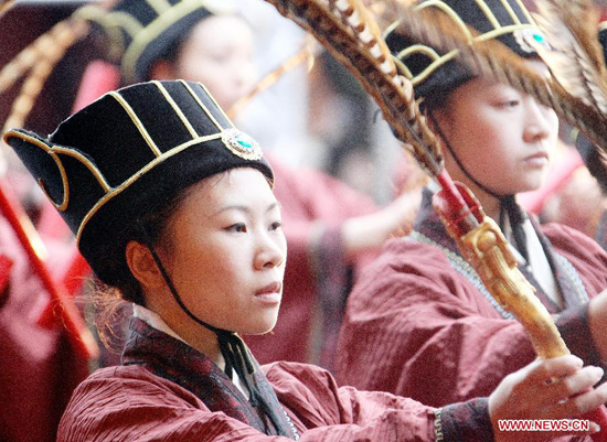 Performers take part in the spring sacrificing ceremony of the Confucius Temple in Taipei, southeast China's Taiwan, Feb. 26, 2012. Nearly 1,000 people attended the ancient-style ceremony, which is held annually to encourage students to set clear goals and study hard in the beginning of a year. (Xinhua/Gao Xueyu)