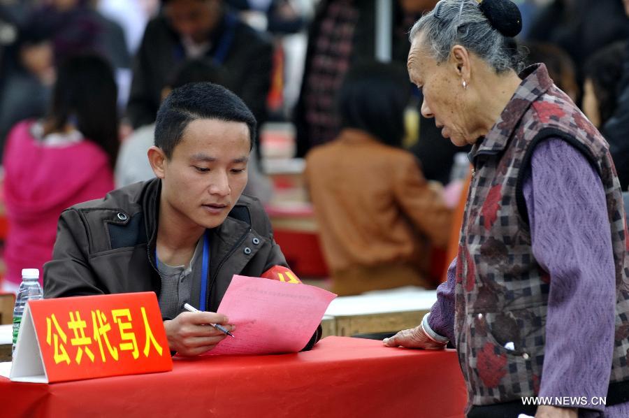 Thousands of people in south China's village of Wukan went to polls Saturday to elect a new village committee, several months after staging massive protests over illegal land sales and other issues. 