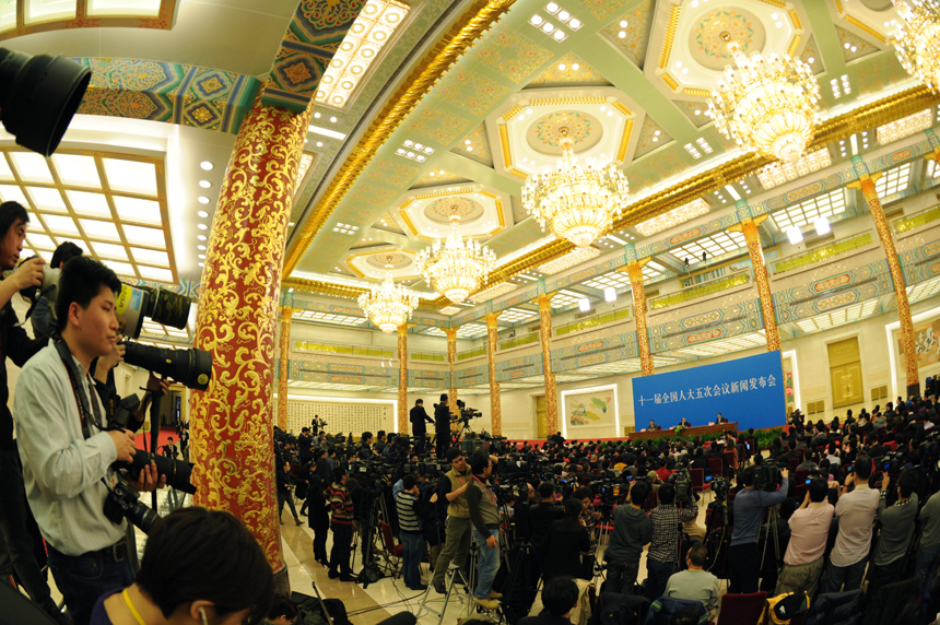 The Fifth Session of the 11th National People's Congress (NPC) holds a press conference Sunday in the Great Hall of the People on the schedule of the session and issues related to the work of the NPC ahead of the session's opening on March 5. Li Zhaoxing, spokesman for the Fifth Session of the 11th NPC, answers questions from journalists during the press conference. [Xinhua photo]