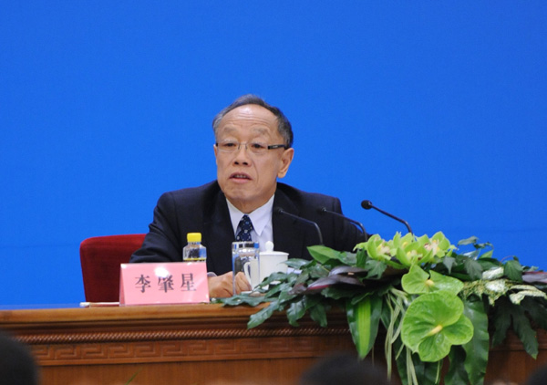  The Fifth Session of the 11th National People's Congress (NPC) holds a press conference Sunday in the Great Hall of the People on the schedule of the session and issues related to the work of the NPC ahead of the session's opening on March 5. Li Zhaoxing, spokesman for the Fifth Session of the 11th NPC, answers questions from journalists during the press conference. [Xinhua photo] 