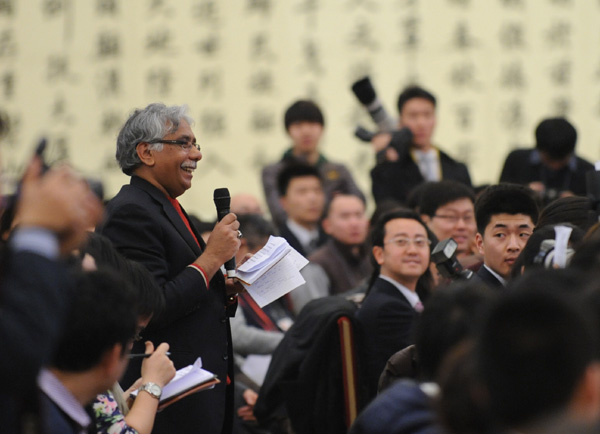 The Fifth Session of the 11th National People's Congress (NPC) holds a press conference Sunday in the Great Hall of the People on the schedule of the session and issues related to the work of the NPC ahead of the session's opening on March 5. Li Zhaoxing, spokesman for the Fifth Session of the 11th NPC, answers questions from a Pakistani journalist during the press conference.