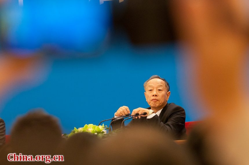 The Fifth Session of the 11th National People's Congress (NPC) holds a press conference Sunday in the Great Hall of the People on the schedule of the session and issues related to the work of the NPC ahead of the session's opening on March 5. Li Zhaoxing, spokesman for the Fifth Session of the 11th NPC, answers questions from journalists during the press conference. [China.org.cn by Chen Boyuan]