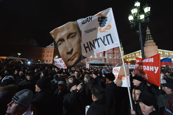 Supporters of Vladimir Putin gather at a square in Moscow to celebrate his winning on March 4, 2012. Russia's presidential candidate Vladimir Putin announced here Sunday that he had won the presidential election. According to an exit poll conducted by the state-run pollster VTsIOM released earlier Sunday, Putin is expected to garner 58.3 percent of votes, enough to avoid a second round. [Xinhua/Jiang Kehong]