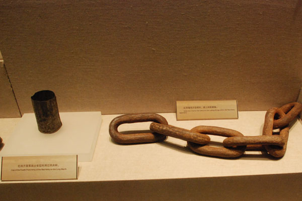 A drinking cup and an iron chain used by Chinese soldiers during the Long March displayed in the new exhibition hall of China's National Museum. 