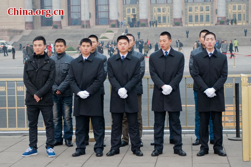 Staff members with China&apos;s secret service ready for duty at the Tian&apos;anmen Square near the Great Hall of the People, the venue of China&apos;s National People&apos;s Congress. [China.org.cn]