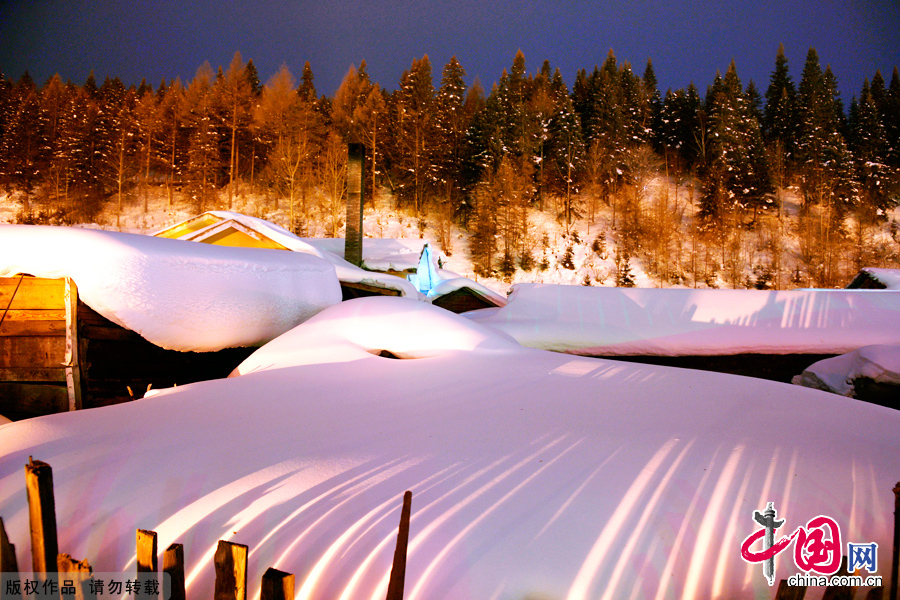 Closed off by surrounding mountains, the village, aptly named Xuexiang, or 'home of snow', has steadily build up its reputation among tourists over the last few years. It consists of around twenty wooden houses decorated with strings of golden corn and red chili hung to dry. In winter the snow here can reach up to two metres. This absorbs sound creating a winter wonderland. 