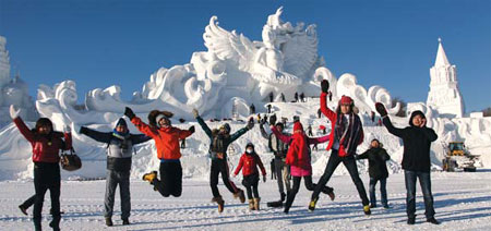 The massive ice sculpture named, 'Snow Dance Style', a 26-meter-high, 24-meter-wide statue of a girl dancing with snow attracts many tourists. Zhao Tianhua / for China Daily