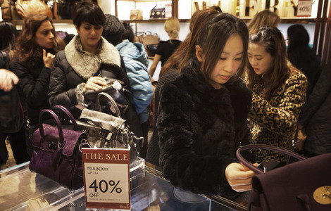 Shoppers at Harrods department store in London. According to China UnionPay Co Ltd, overseas consumption made through its credit card network jumped by 66.7 percent to 300 billion yuan ($47 billion) last year, up from 180 billion yuan in 2010. [File photo]