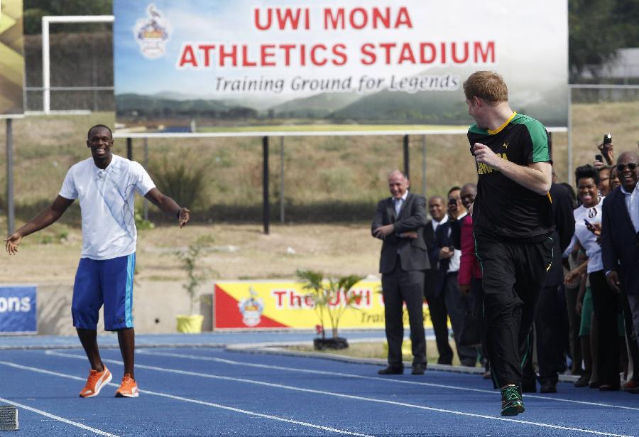 Britain's Prince Harry is first out of the blocks against Olympic sprint champion Usain Bolt, Tuesday March 6 2012 at a mock race at the University of the West Indies, in Jamaica.