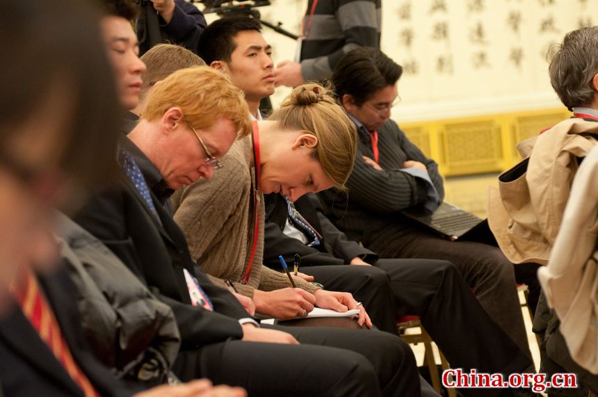 Foreign journalist attend the press conference held by Chinese Foreign Minister Yang Jiechi Tuesday morning on the sidelines of the fifth session of the 11th National People&apos;s Congress at a press conference held at the Great Hall of the People in Beijing, March 6, 2012. [China.org.cn]
