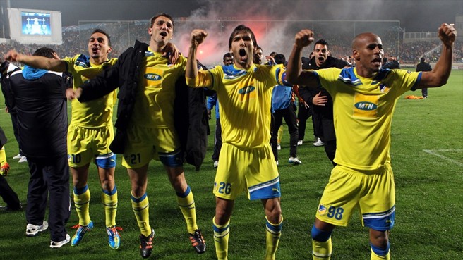  APOEL players celebrate after a penalty shootout victory over Lyon for a place in the quarterfinals.