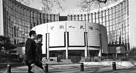 The headquarters of the People's Bank of China in Beijing. The PBOC is likely to launch a pilot program that allows some commercial lenders to securitize assets. The trial could involve a securitized quota of 50 billion yuan ($7.9 billion). [China Daily]