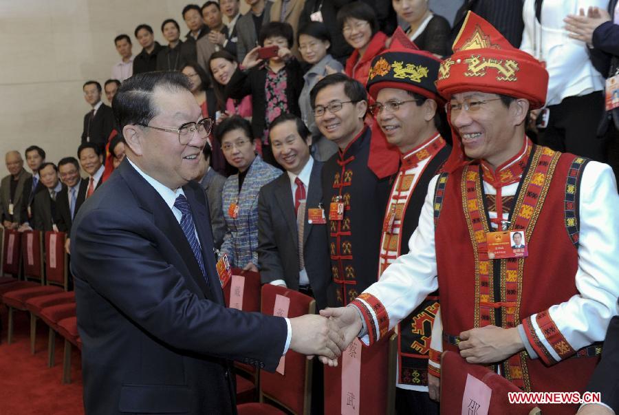 Li Changchun (L, front), member of the Standing Committee of the Political Bureau of the Communist Party of China (CPC) Central Committee, visits deputies to the Fifth Session of the 11th National People's Congress (NPC) from south China's Hainan Province and joins their panel discussion in Beijing, capital of China, March 9, 2012. (Xinhua/Zhang Duo) 