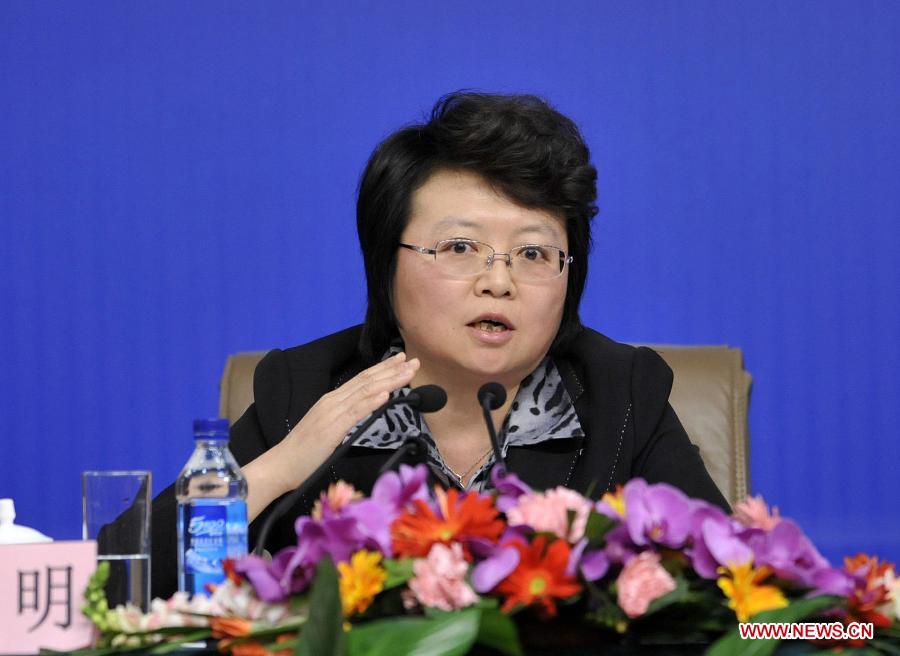 Wu Ming, a member of the 11th National Committee of the Chinese People's Political Consultative Conference (CPPCC) answers questions from journalists during a news conference of the Fifth Session of the 11th CPPCC National Committee on the reform of medical, health care services in Beijing, capital of China, March 10, 2012. (Xinhua/Wang Peng) 