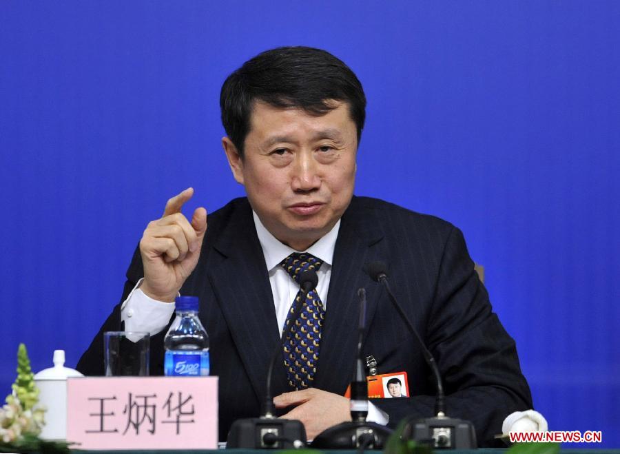 Wang Binghua, a member of the 11th National Committee of the Chinese People's Political Consultative Conference (CPPCC), speaks during a news conference of the Fifth Session of the 11th CPPCC National Committee on the utilization of new energy and clean energy in Beijing, capital of China, March 10, 2012. (Xinhua/Wang Peng) 