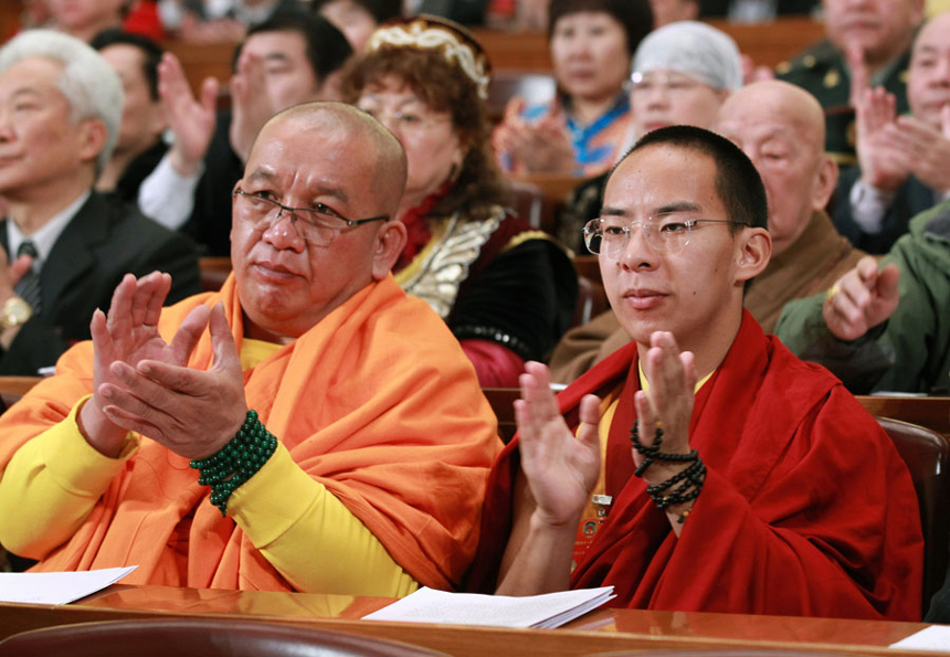 The 11th Panchen Lama, Bainqen Erdini Qoigyijabu (R), attends the 11th National Committee of the Chinese People's Political Consultative Conference (CPPCC), China's top political advisory body, which concluded its annual session in Beijing Tuesday morning. 