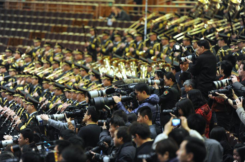 Journalists work during the closing meeting of the Fifth Session of the 11th National Committee of the Chinese People's Political Consultative Conference (CPPCC) at the Great Hall of the People in Beijing, capital of China, March 13, 2012.