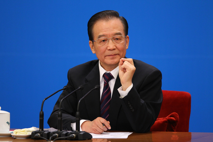 Chinese Premier Wen Jiabao meets the press after the closing meeting of the Fifth Session of the 11th National People's Congress (NPC) at the Great Hall of the People in Beijing, March 14, 2011. In the photo a reporter from Taiwan asks questions. 