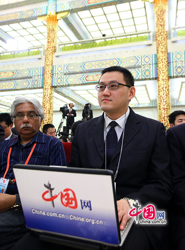 Chinese Premier Wen Jiabao meets the press after the closing meeting of the Fifth Session of the 11th National People's Congress (NPC) at the Great Hall of the People in Beijing, March 14, 2011. In the photo is Chen Boyuan, China.org.cn's reporter.