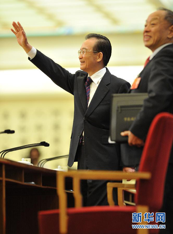 Chinese Premier Wen Jiabao meets the press after the closing meeting of the Fifth Session of the 11th National People's Congress (NPC) at the Great Hall of the People in Beijing, March 14, 2011.