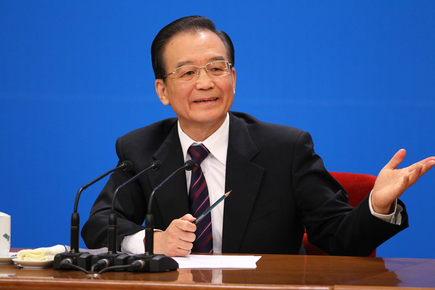 Chinese Premier Wen Jiabao meets the press after the closing meeting of the Fifth Session of the 11th National People's Congress (NPC) at the Great Hall of the People in Beijing, March 14, 2011. In the photo a reporter from Taiwan asks questions. 