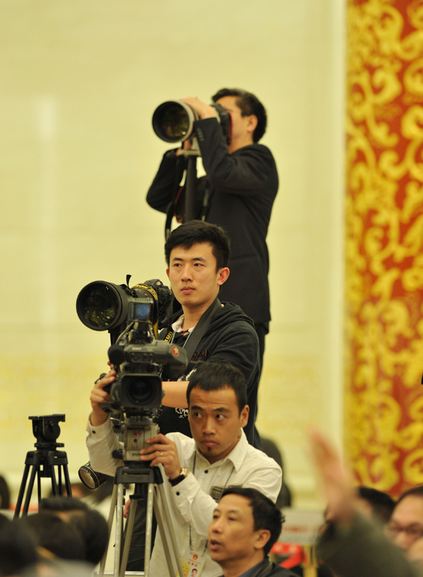 Chinese Premier Wen Jiabao meets the press after the closing meeting of the Fifth Session of the 11th National People's Congress (NPC) at the Great Hall of the People in Beijing, March 14, 2011.